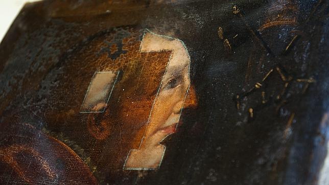 Uno de los lienzos de un papa sobre el que se ha hecho una prueba de limpieza. Como se puede apreciar, su superficie est muy deteroriado por el uso de barnices y resinas que los cubren. 