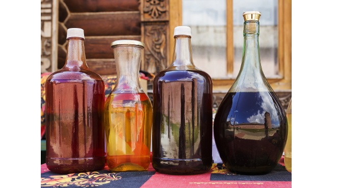 Russian alcoholic drink mead with reflection Kremlin in Suzdal, Russia