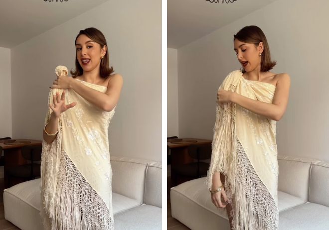 Marina García enseñándo a ponerse el mantón como vestido